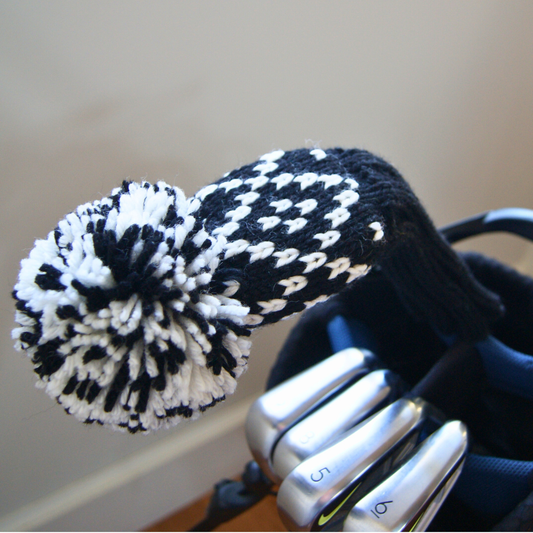 Knit hybrid cover with a black and white argyle pattern