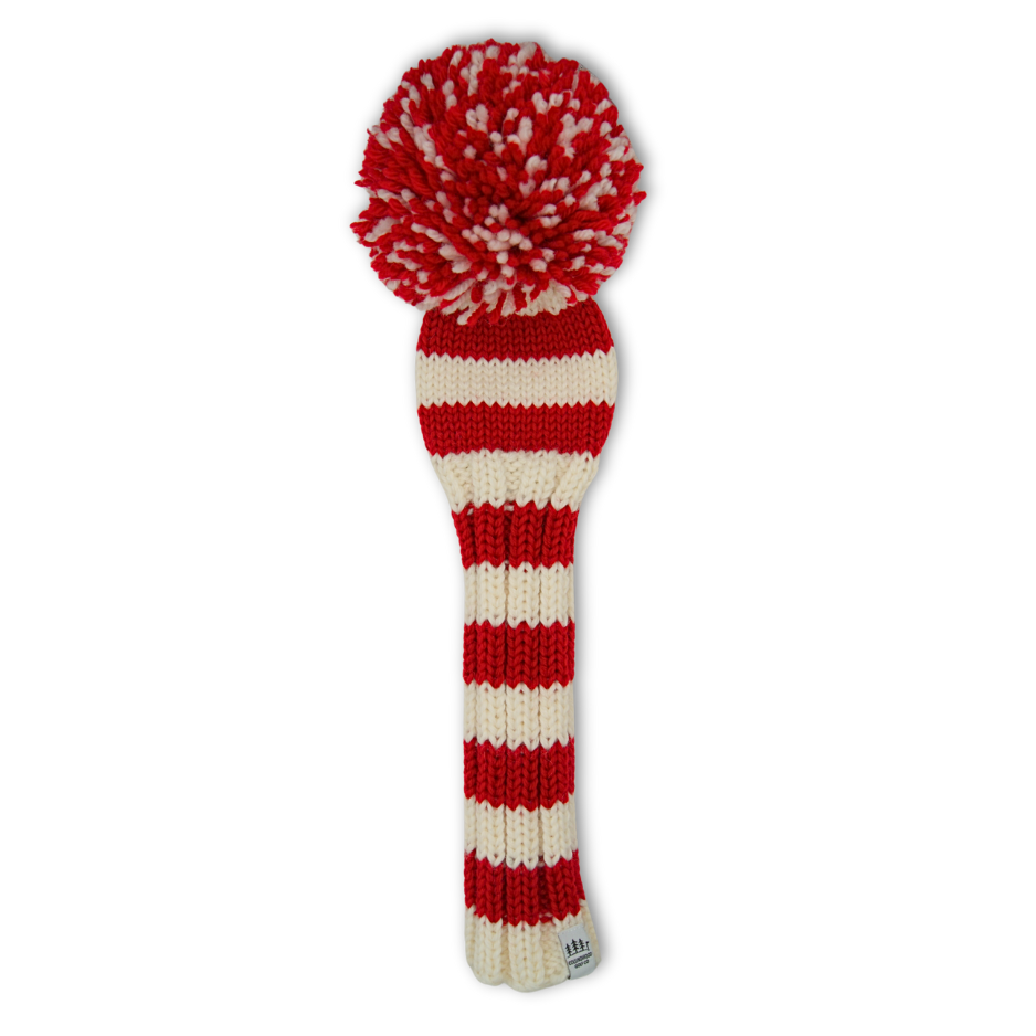 Red and white striped knit golf club head cover with a pom-pom on a white background